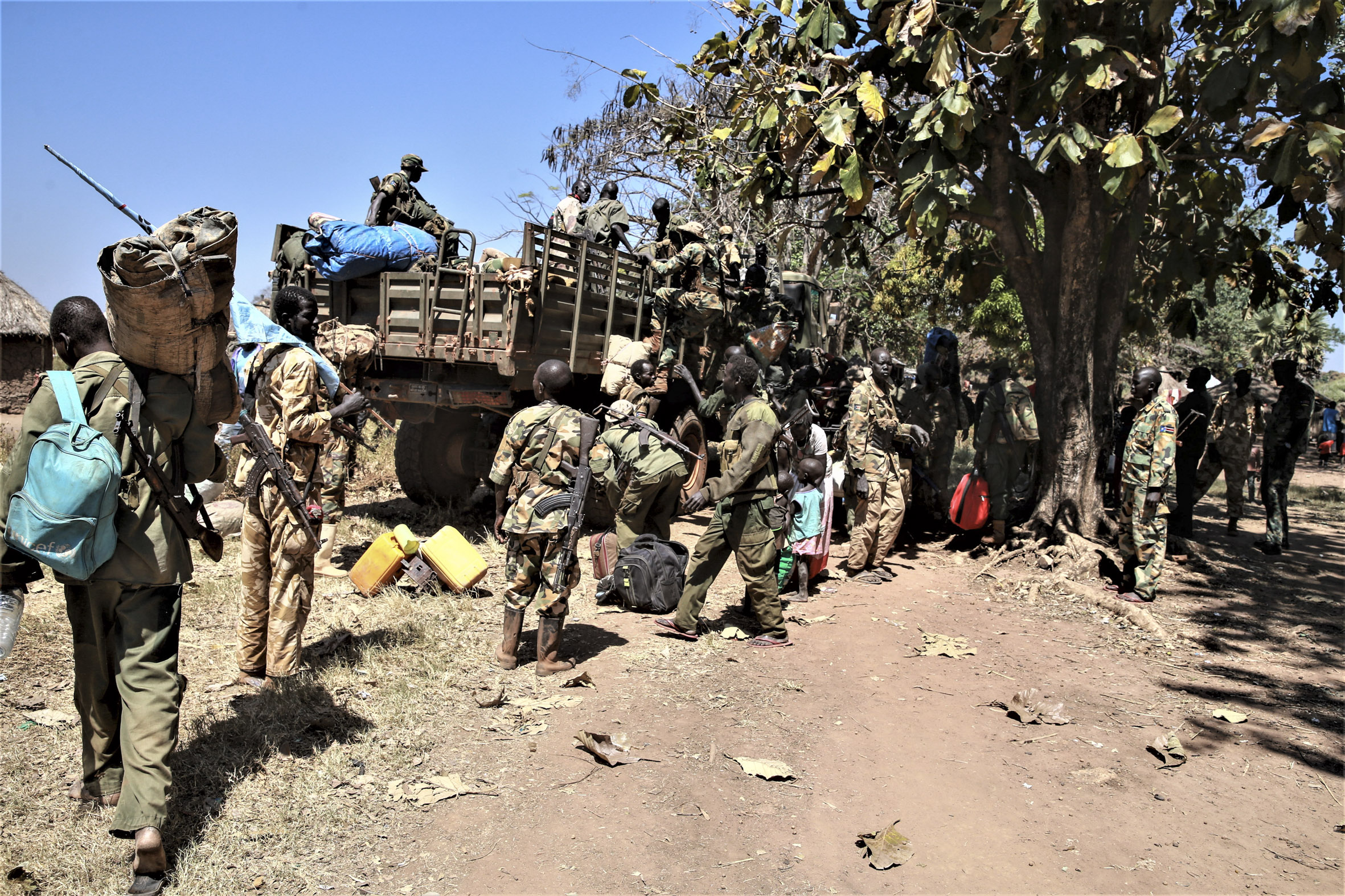 South Sudan Defense Force soldiers and Sudan People’s Liberation Movement soldiers head to a unification training site in Maridi, 2020. 