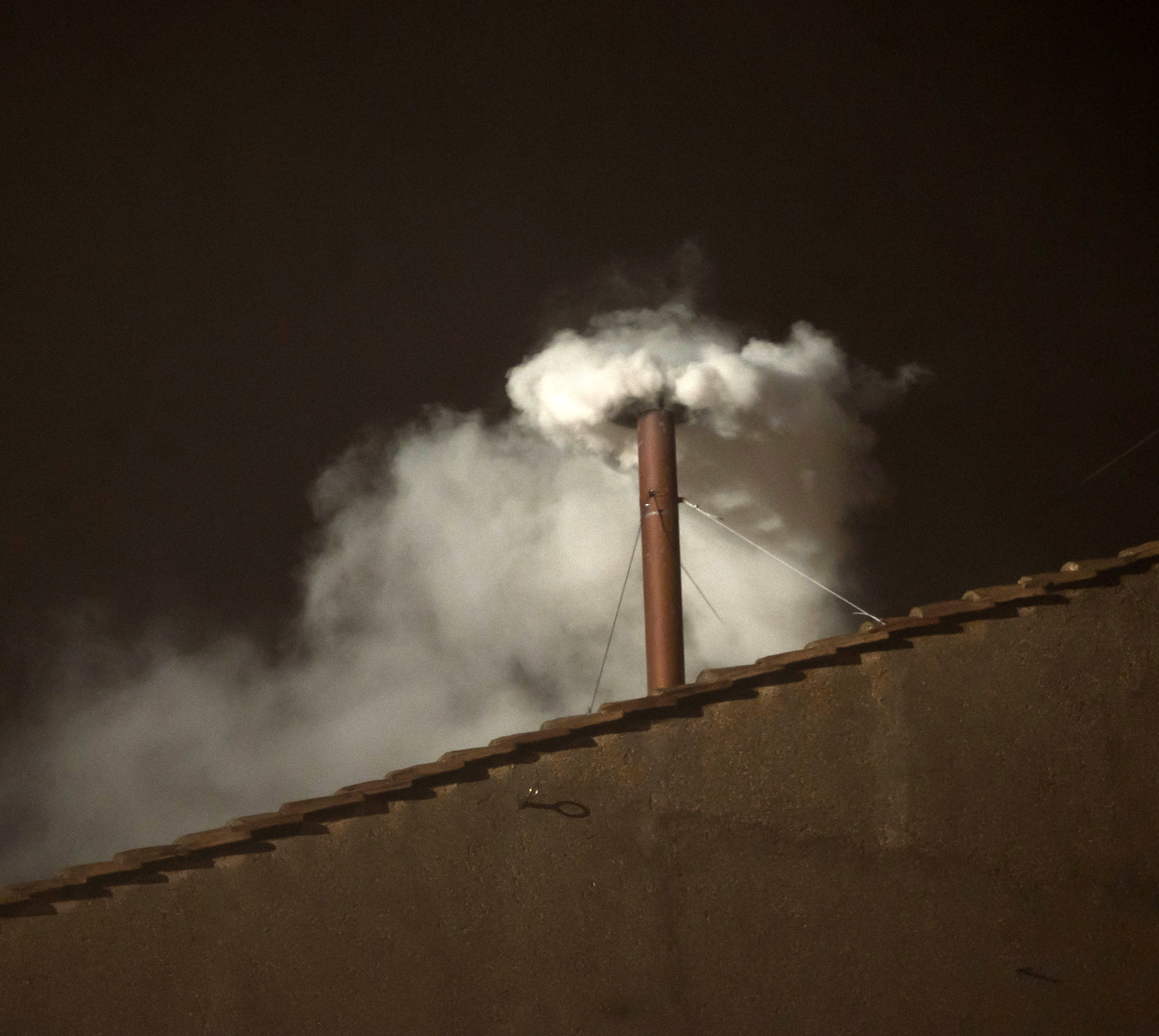 White smoke rising from the Vatican signaling the election of a new pope, 2013. (Image by Catholic Church England)