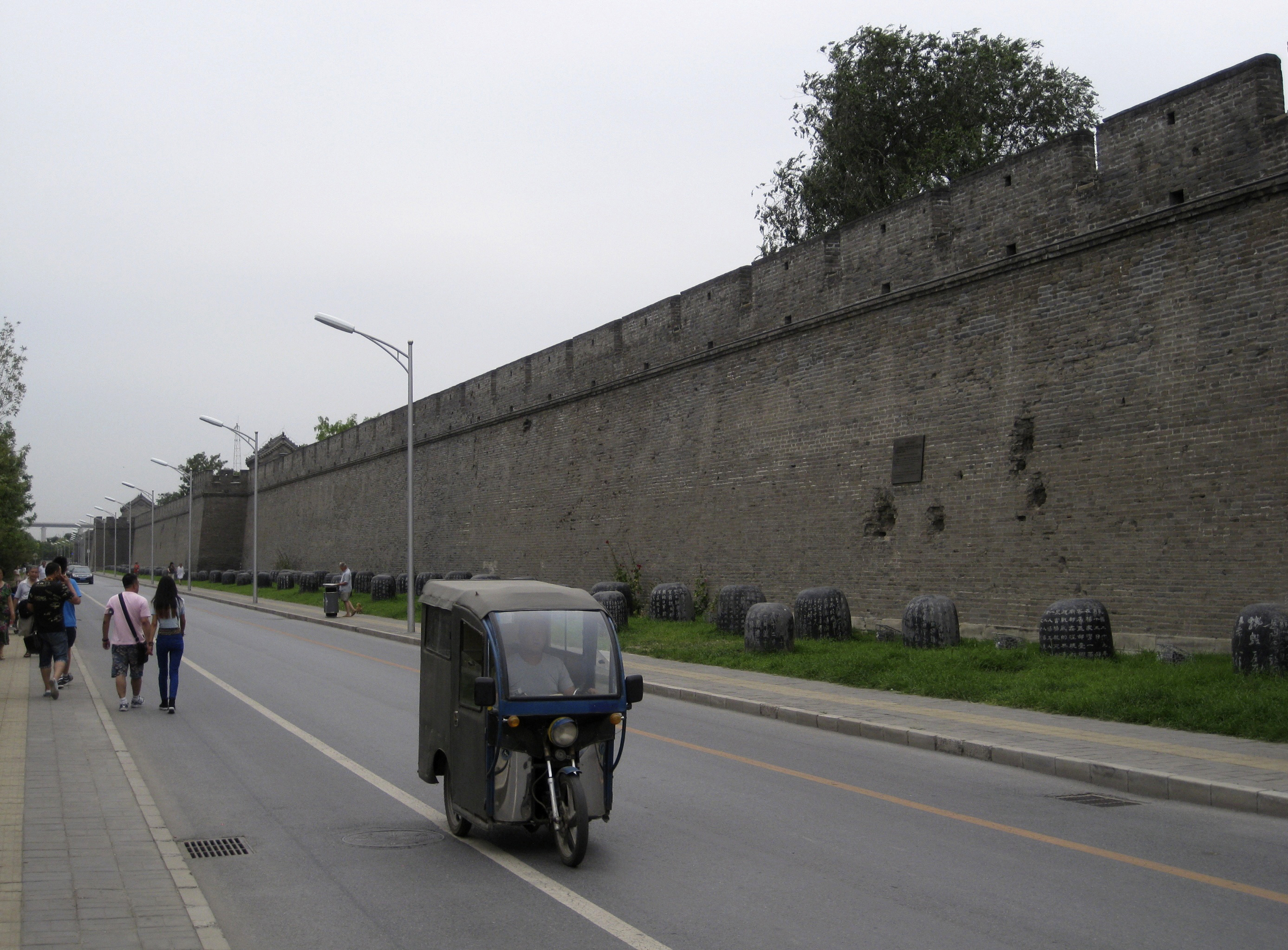 Artillery-damaged Wanping city wall with present-day stone drums commemorating events of the 2nd Sino-Japanese War (1937-45). Elevated high-speed train tracks visible in distance. Source: Author’s Collection, 2014.