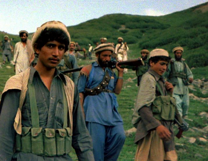 Mujahideen fighters crossing into Afghanistan from Pakistan,1985.