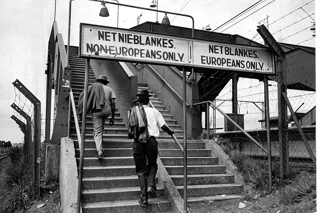 Segregation signs at a South African train station, ca. 1960s..