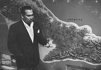 Fulgencio Batista studies the Sierra Maestra during the insurgency led by Fidel Castro.