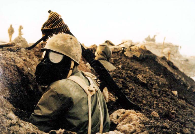 An Iranian soldier wears a gas mask to protect from chemical weapons during the Iran-Iraq War.