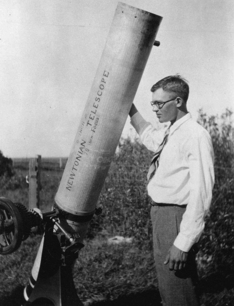 The astronomer Clyde Tombaugh, discoverer of Pluto here shown with his homemade 9-inch telescope.