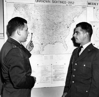 Captain Edward J. Ruppelt (left), head of Project Blue Book, at the Wright-Patterson Air Force Base project office in March 1953