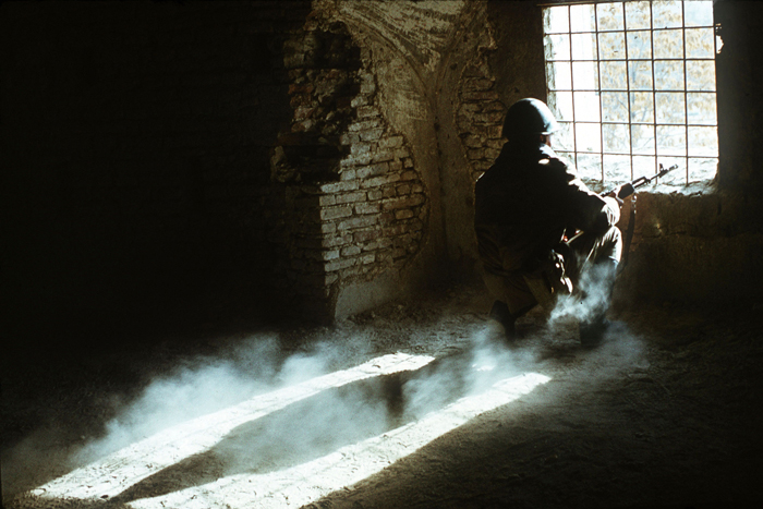 A Soviet soldier waits during the Soviet-Afghan War, 1988.