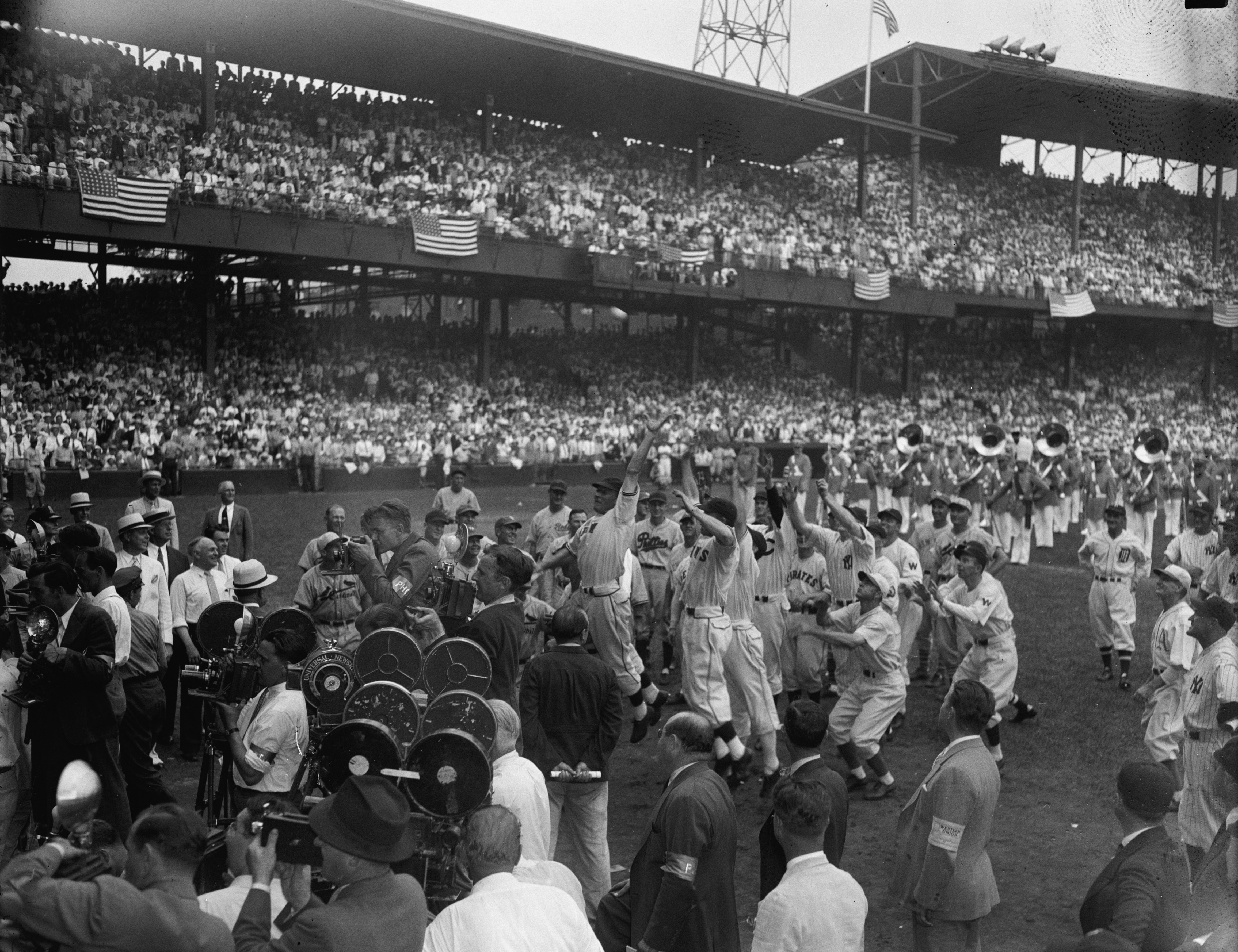 Baseball's 1937 All-Stars scramble to get first ball thrown out by President Franklin Delano Roosevelt.