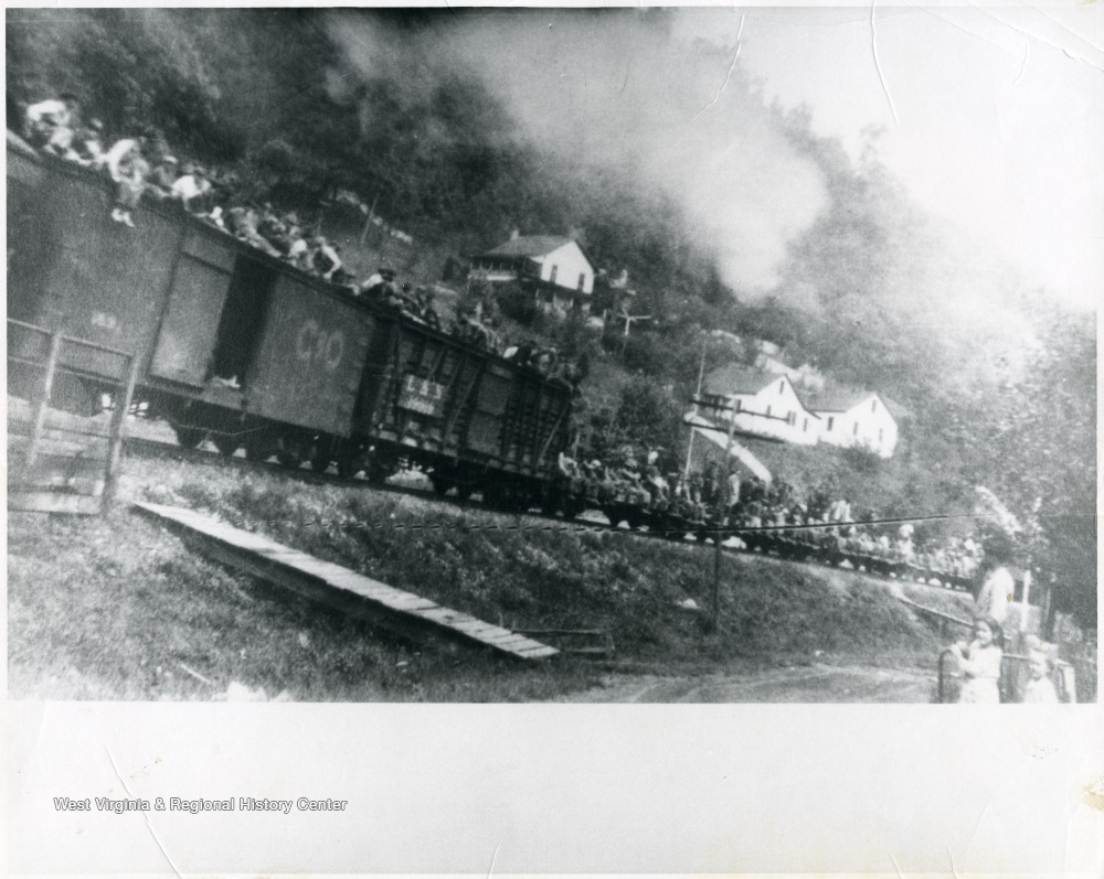 Freight train loaded with miners.