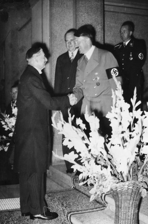 British Prime Minister Neville Chamberlain shaking hands with Hitler in September of 1938.