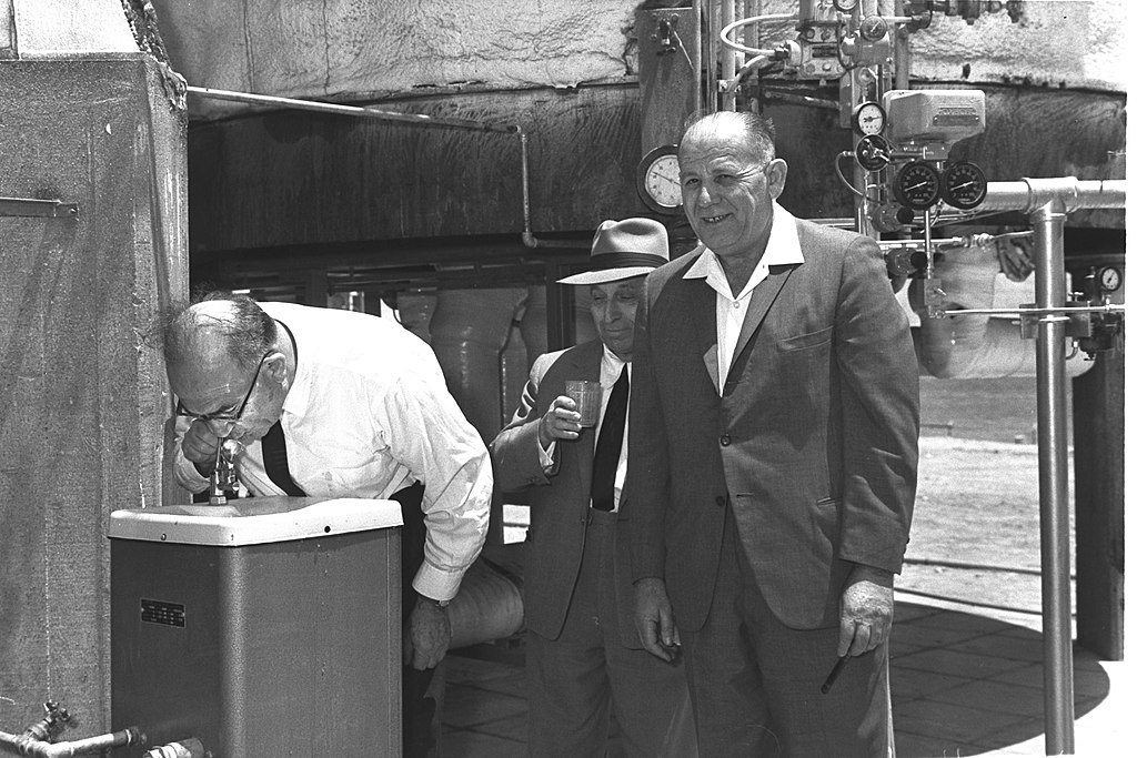 PRIME MINISTER LEVI ESHKOL (L), DR. ALEXANDER ZARCHIN & MIN. OF DEVELOPMENT YOSEF ALMOGI DRINKING WATER PRODUCED AT THE "ZARCHIN" DESALINATION PLANT IN EILAT.