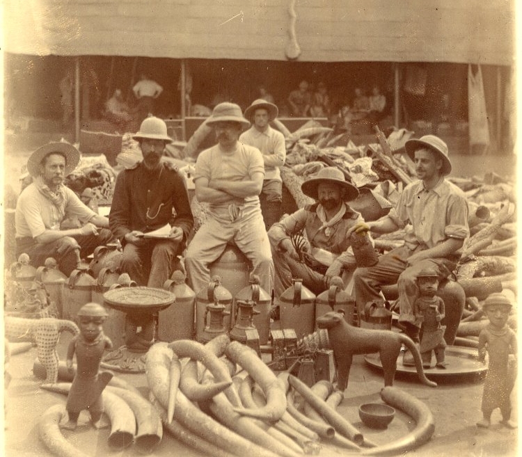 Members of the punitive expedition in Benin surrounded by looted objects from the royal palace, 1897. 