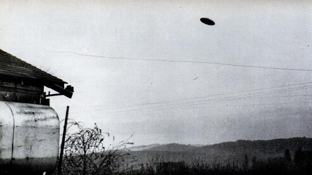 One of the McMinnville UFO photographs. Skeptics have concluded that the UFO was a small model suspended by wires or string from the power lines visible at the top of the photo.