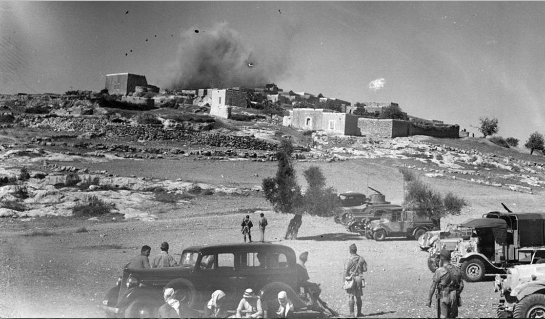 The Arab village of Miar, near Haifa, being blown up during a period of unrest in the British mandate of Palestine.