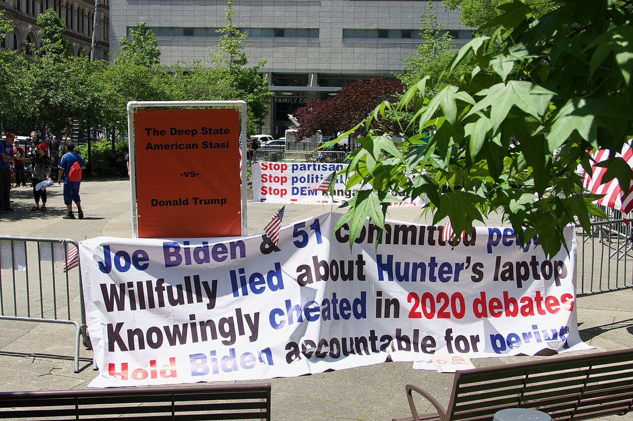 Signs in support of President Trump's goal of upending the deep state, 2024. 