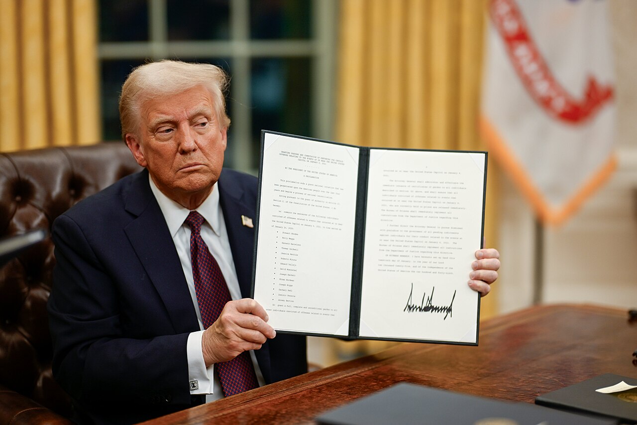 Trump holding up an executive order he signed on the first day of his second term in office