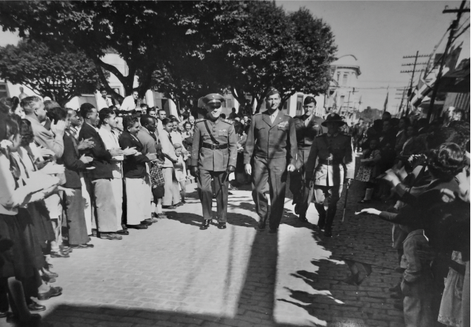 General Mark W. Clark (center), accompanied by American interpreter and liaison officer Vernon Walters (right) and Brazilian officials are greeted by the crowds in Rio. Photograph, Phil Twombly Collection, MI888, 10th Mountain Division Resource Center, Denver Public Library (DPL). Image courtesy of the DPL.
