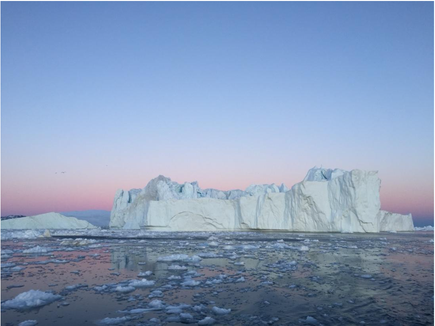 An iceberg floats in Disko Bay, photograph from author.