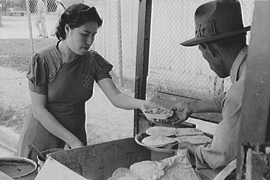 A woman selling baked beans and tortillas in San Antonio, c. 1939.