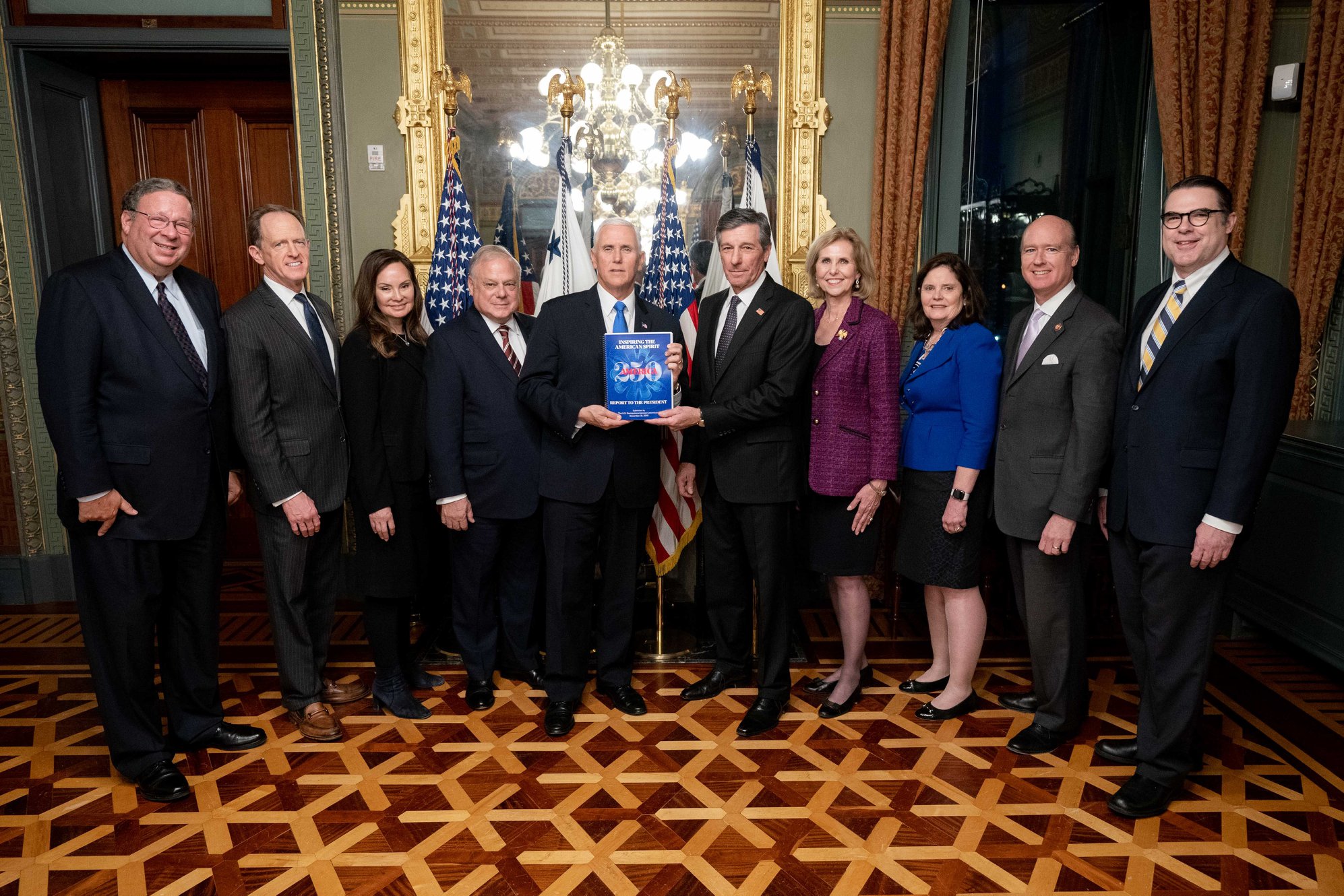Members of the United States Semiquincentennial Commission present vice president Mike Pence with a copy of a Congressionally-required report on January 15, 2020, at the Vice President's Ceremonial Office in the Eisenhower Executive Office Building.
