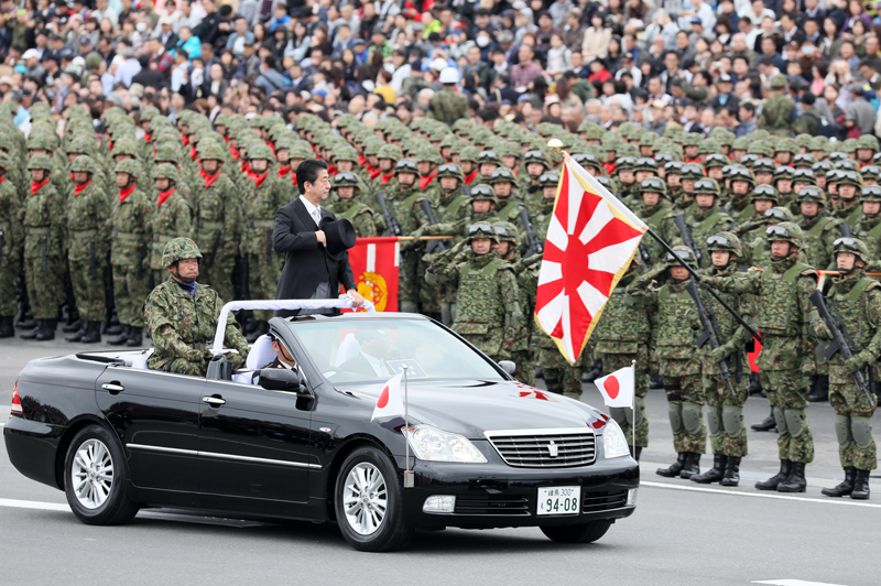 Former Prime Minister of Japan Shinzō Abe reviewing a parade of the Self-Defense Forces, 2018.
