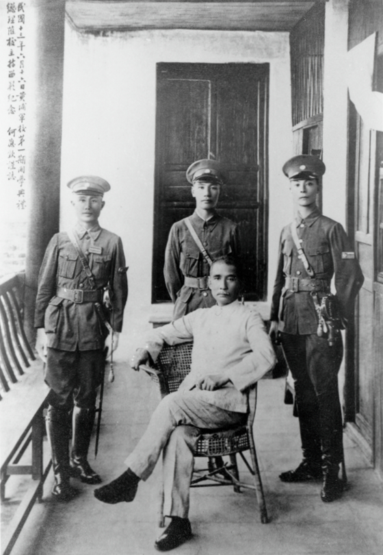 Chiang Kai-Shek with (standing middle) with Sun Yat-sen (seated), 1924.