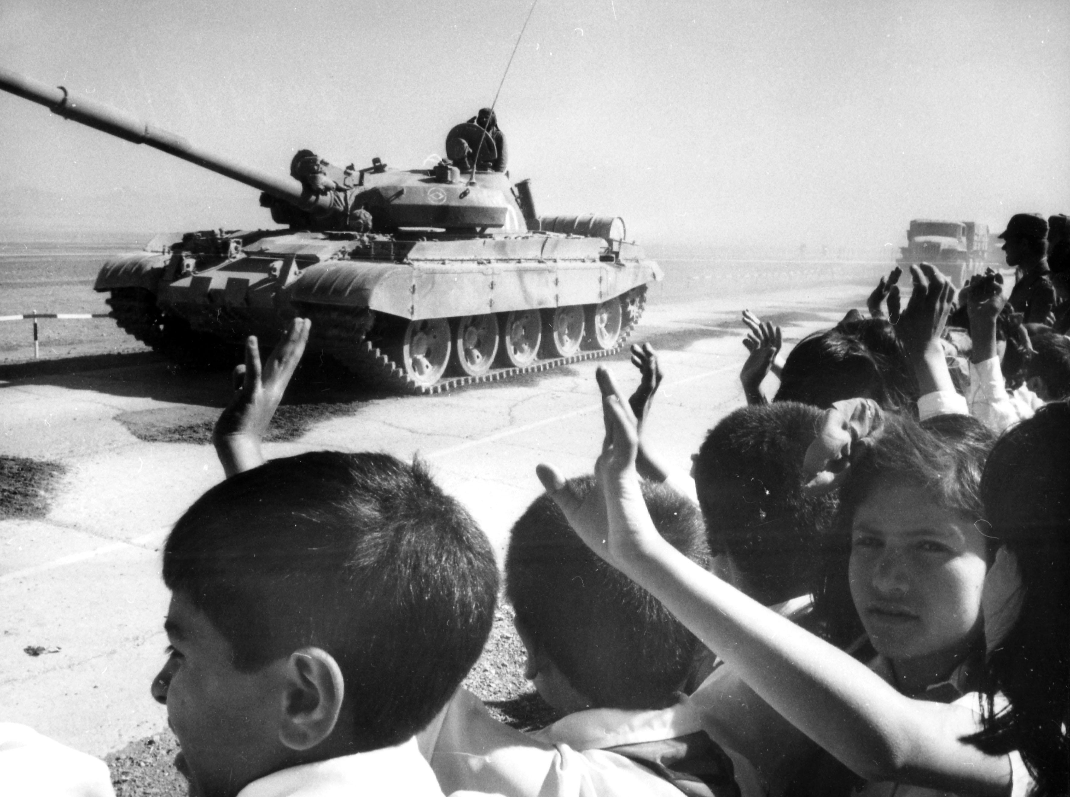 A Soviet battle tank leaving Afghanistan as part of the publicized withdrawal announced by Gorbachev, 1987