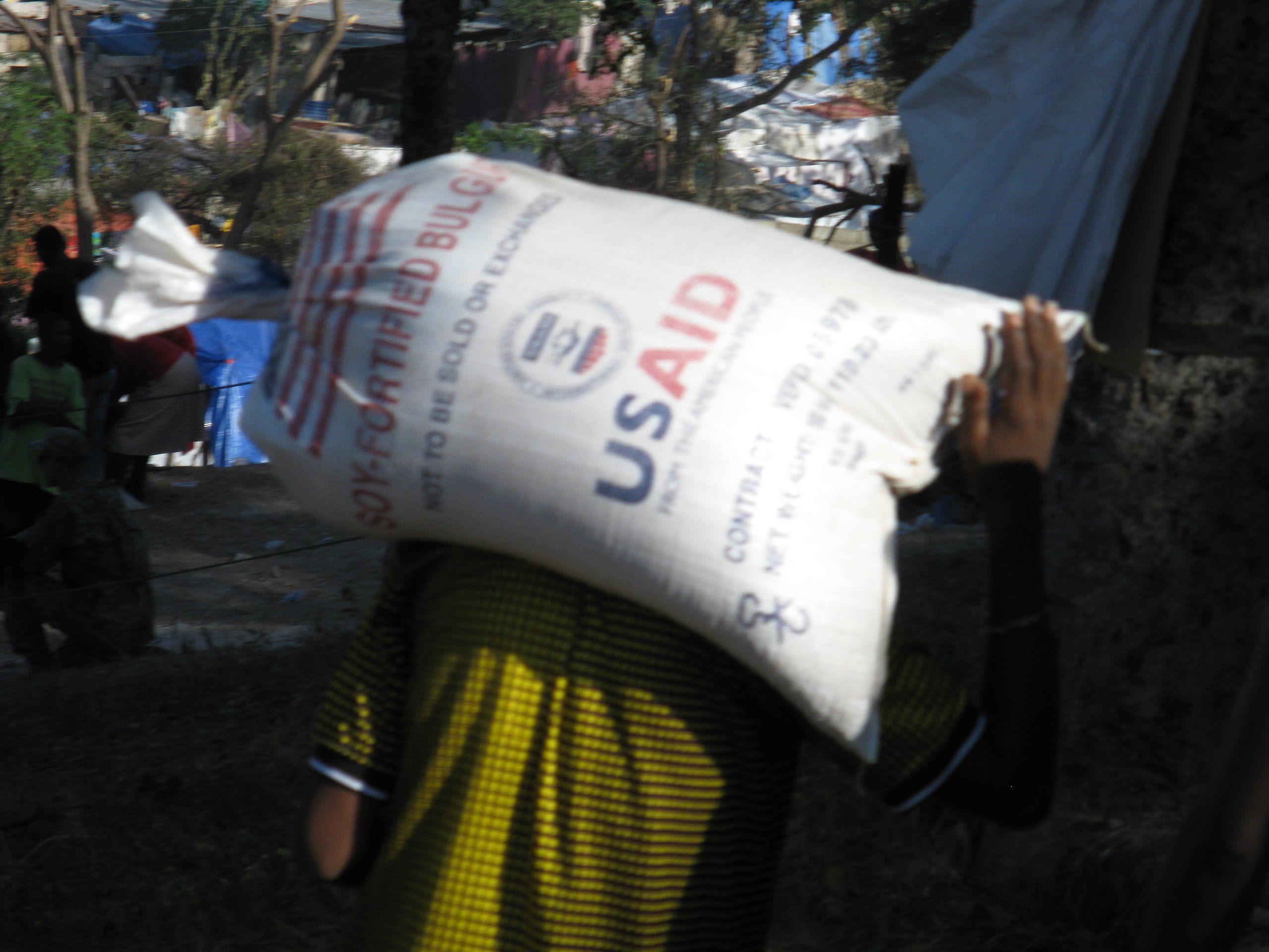 A USAID-funded food distribution at the Petionville Country Club, Port au Prince, Haiti, 2008.