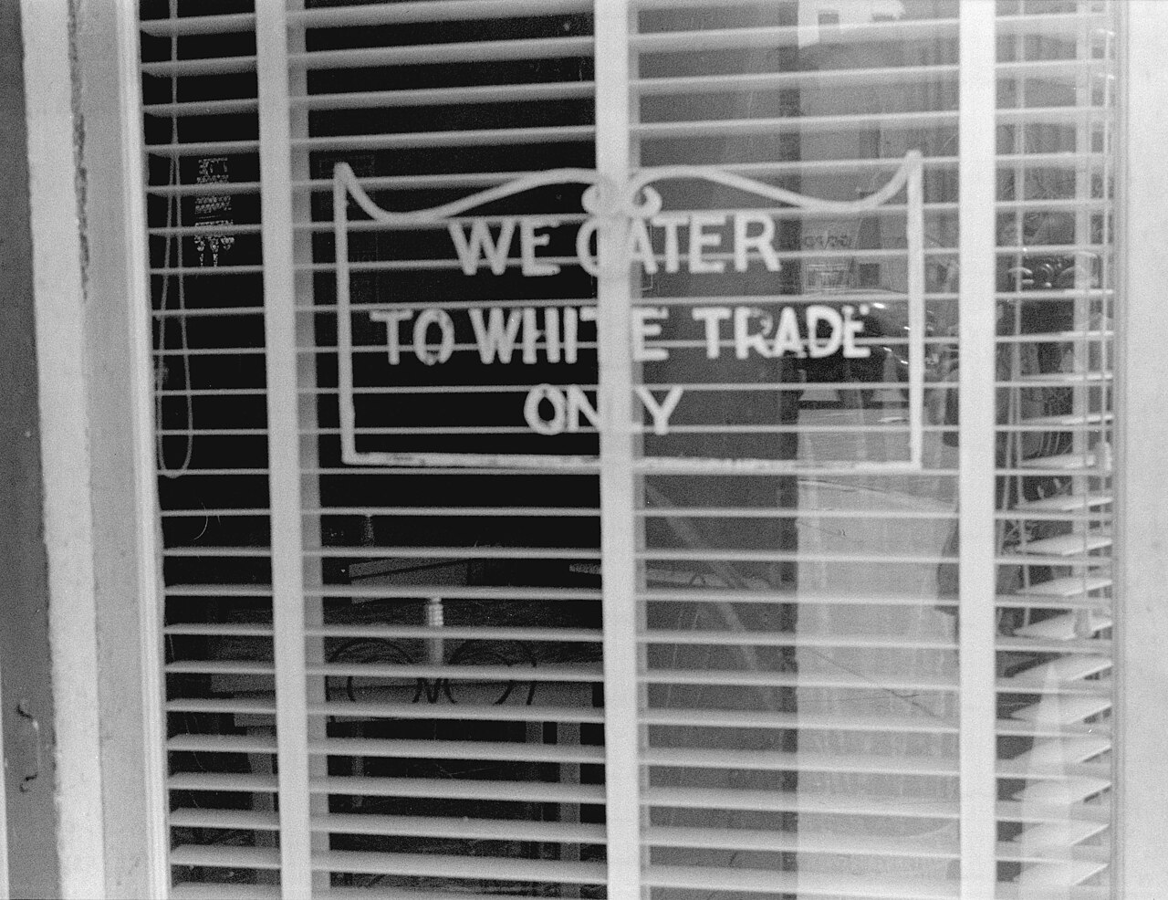 Sign on a restaurant: "We Cater to White Trade only.", taken in Lancaster, Ohio, 1938.