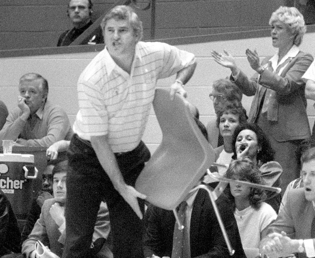 Coach Bob Knight holding a chair