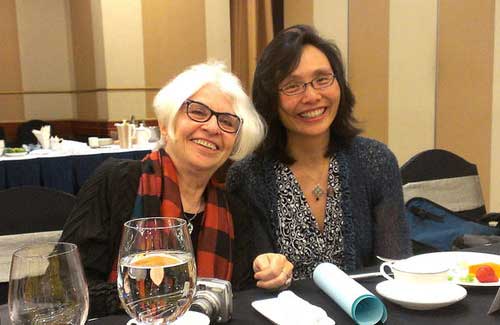 Judy Gumbo Albert (left) pictured with author at a banquet.