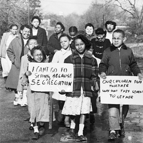 a group of childen and mothers protesting school segregation