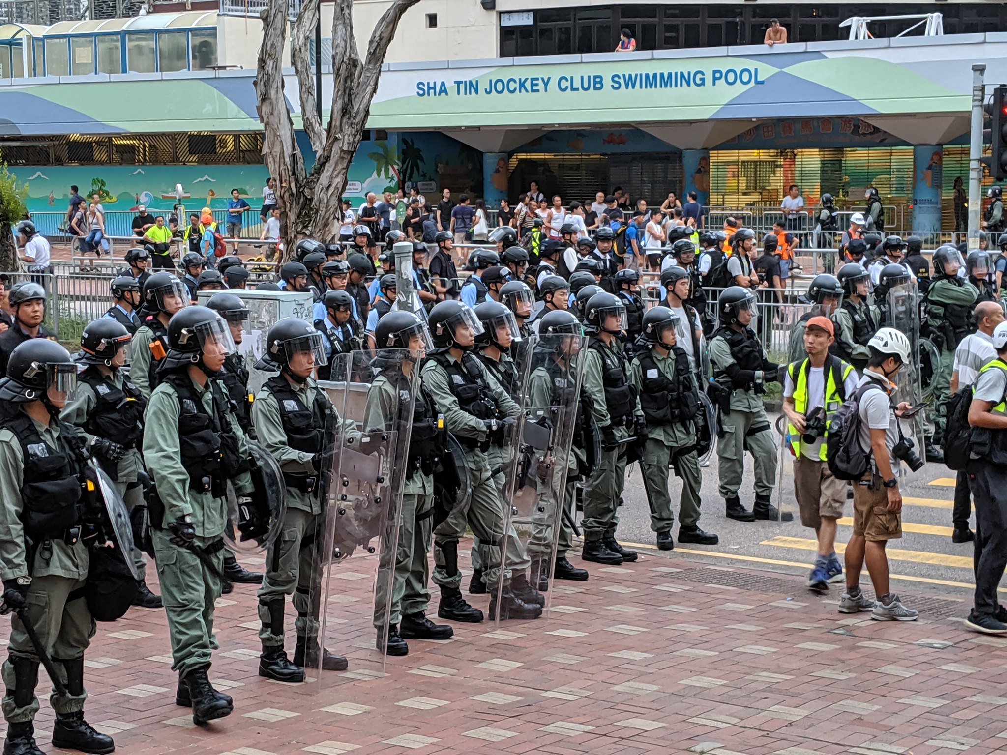 In July 2019, police gathered near an upscale mall in Sha Tin, Hong Kong, to control protesters.