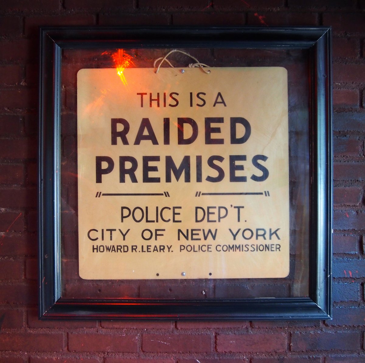  A 'raided premises' sign.
