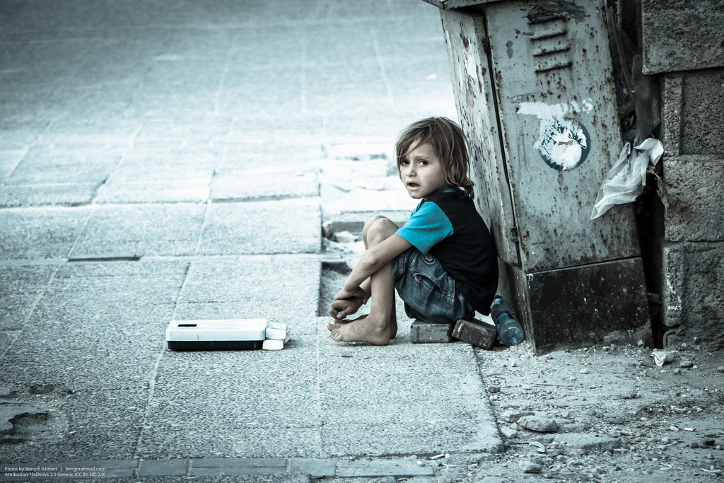 A Syrian boy waiting for assistance in 2014.