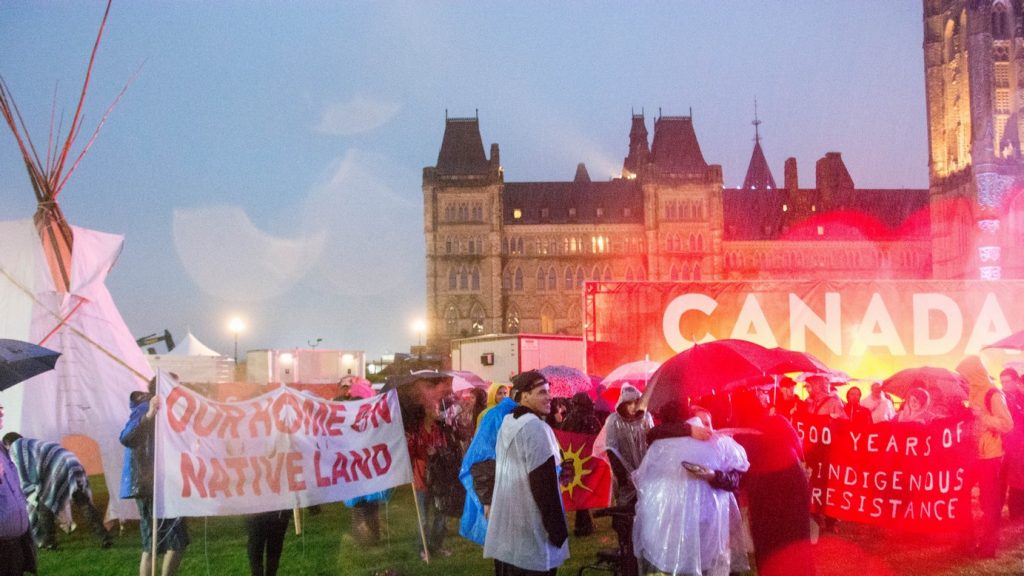 Protesters on Parliament Hill during Canada’s 150th birthday celebrations in 2017