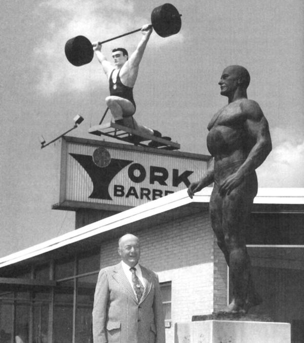 American weightlifting coach Bob Hoffman with a statue of himself.