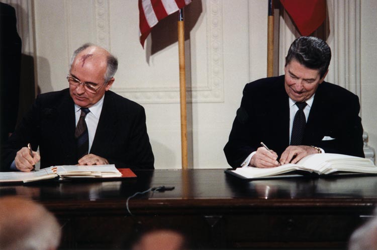 Soviet General Secretary Mikhail Gorbachev and American President Ronald Reagan signing the INF Treaty.