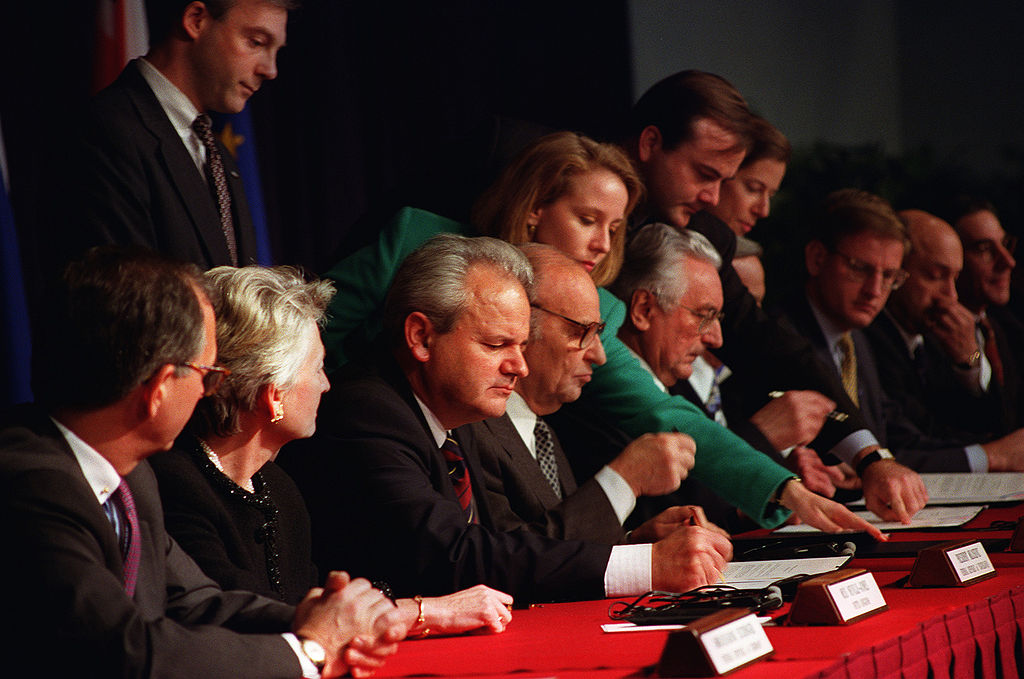 Slobodan Milošević (left), Alija Izetbegović (center) and Franjo Tuđman (right) sign Dayton Peace agreement, 1995.