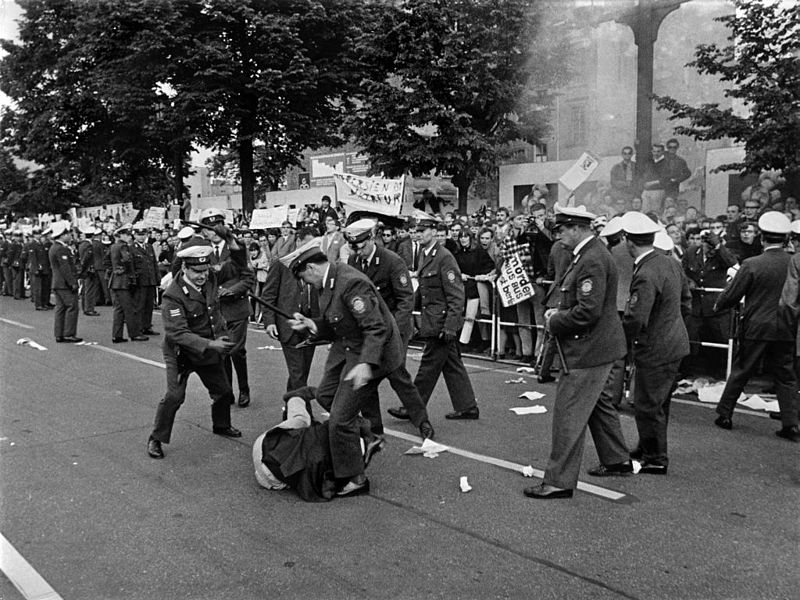 Policemen beating a demonstrator in 1967 in Berlin.