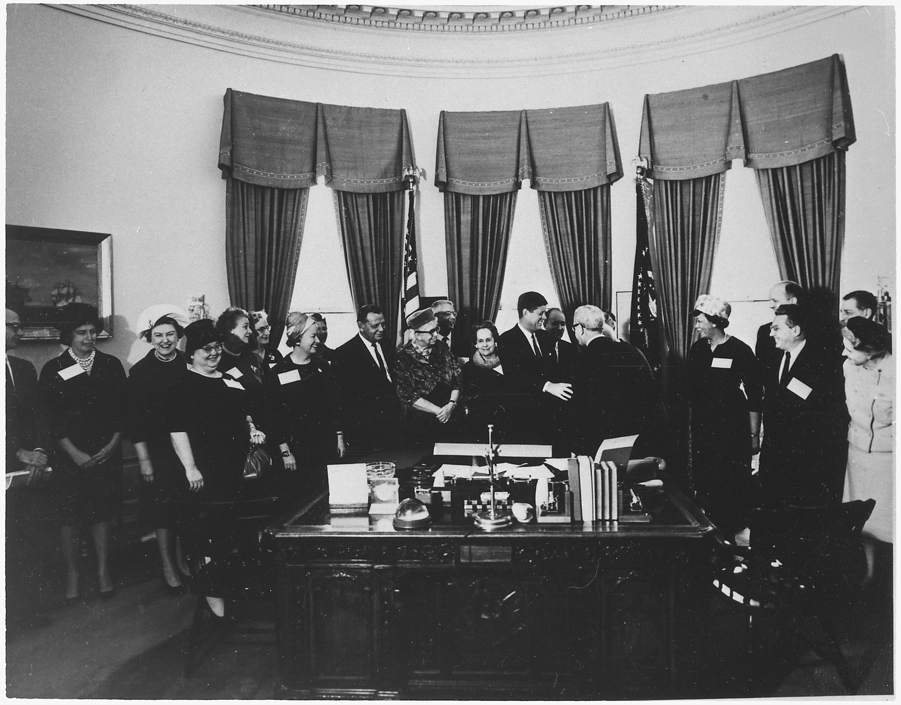 President John F. Kennedy meeting with Eleanor Roosevelt and other prominent women.