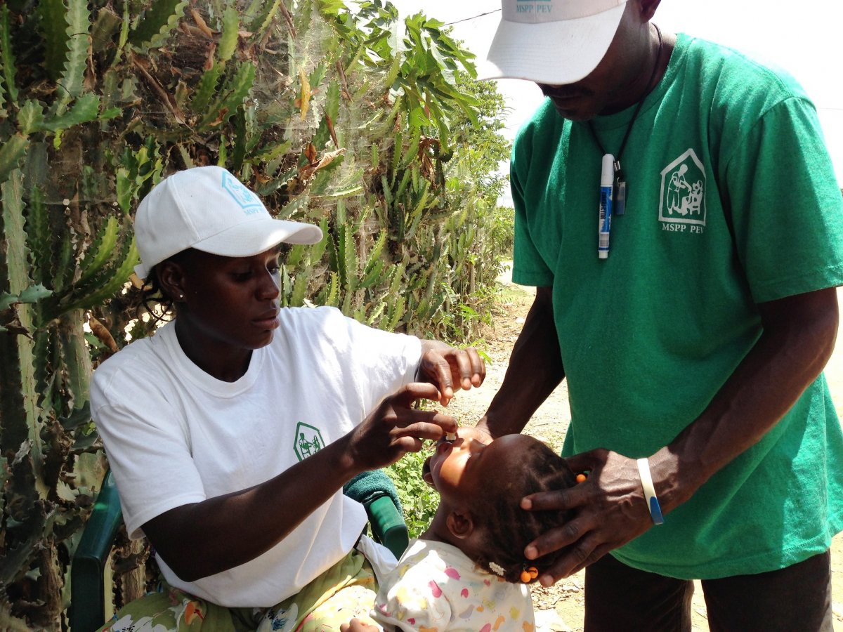 Vaccination team member giving a cholera vaccine.