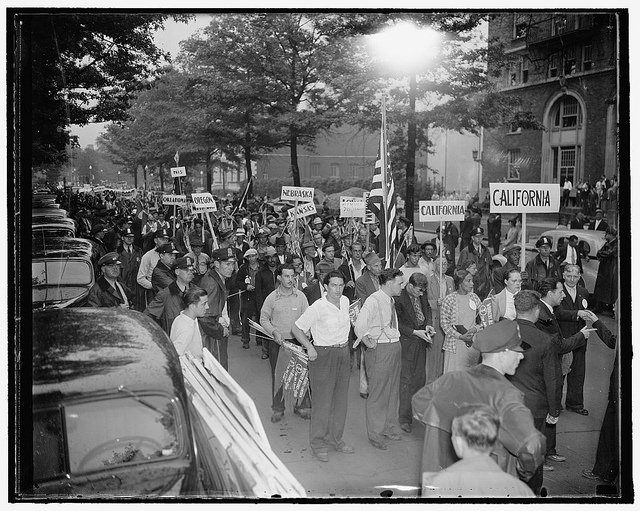In 1937, over a thousand marched past the Works Progress Administration in Washington D.C., demanding the reinstatement of jobs cut earlier that year.