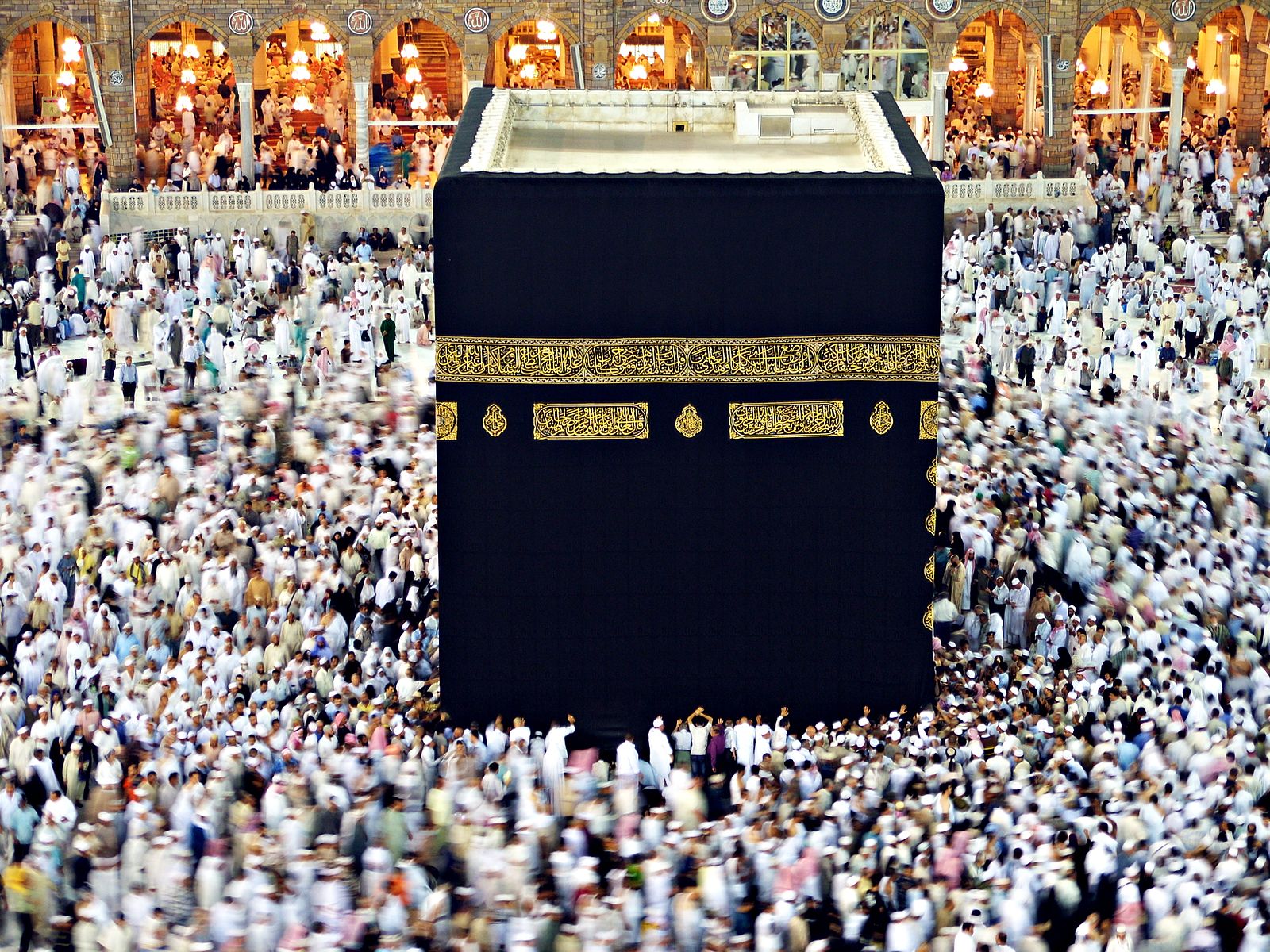 Pilgrims circle the Kaaba at the Grand Mosque.