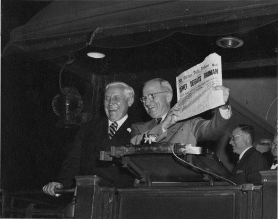Postmaster Bernard Dickmann and newly elected President Harry S. Truman hold up newspaper.