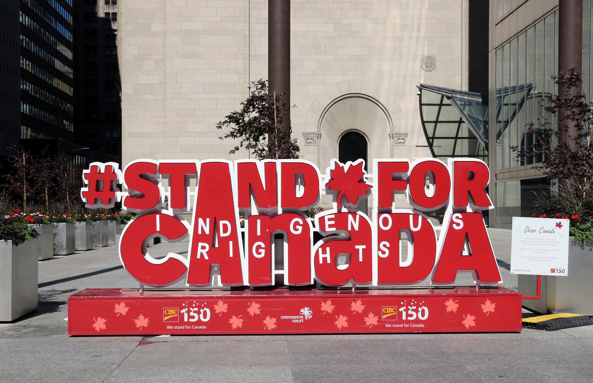 A sign celebrating Canada’s 150th anniversary on which protesters added the words “Indigenous Rights.”