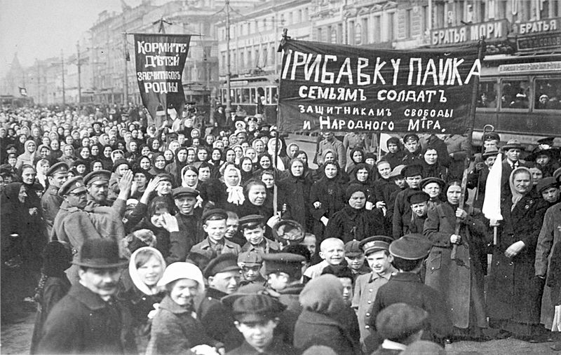 A demonstration in St. Petersburg, Russia during the February Revolution. The banners read: 'Feed the children of the defenders of the motherland' and 'Increase payments to the soldiers’ families—defenders of freedom and world peace.'