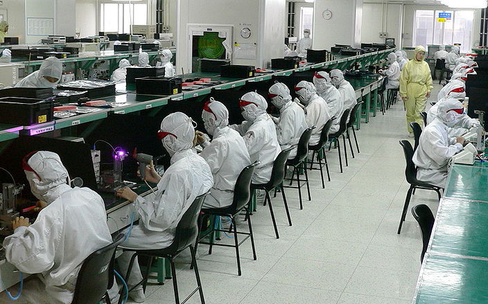 Workers in electronics factories in Guangdong Province.