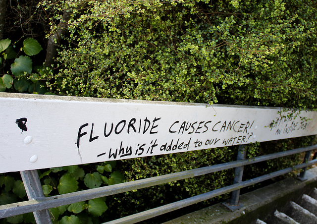 Graffiti in Wellington, New Zealand declaring that fluoride causes cancer and questioning why it is added to water