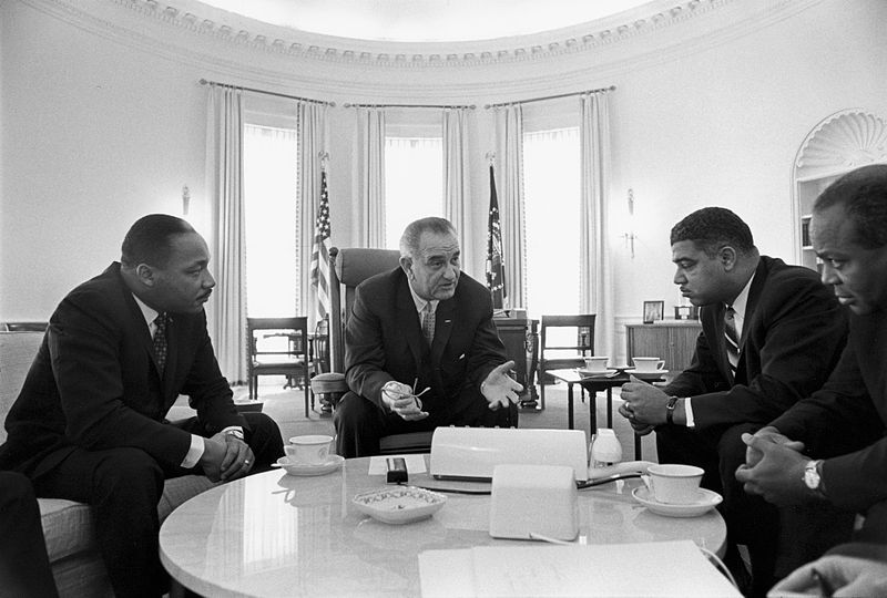 President Lyndon B. Johnson meets with Civil Rights Leaders Martin Luther King Jr., Whitney Young, and James Farmer in the Oval Office, 1964.