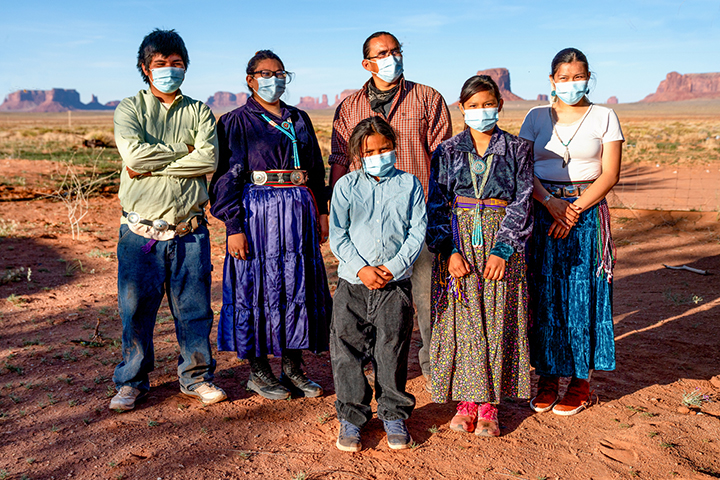 Navajo Nation citizens stand with face masks during the Covid-19 pandemic.